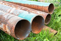Old rusty water pipes of the city. Water supply system repair.
