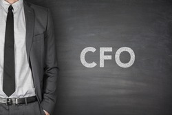 CFO text on black blackboard with businessman