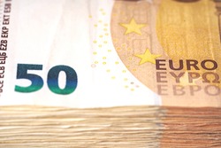 Money laundering on clothesline on light background. 50 eur notes. 50 eur banknotes