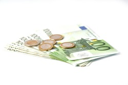 Money laundering on clothesline on light background. 100 eur notes. Banknotes and coins at white background