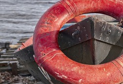 life buoy on the bow of an old boat.