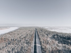 snow road in forest. View at road from sky