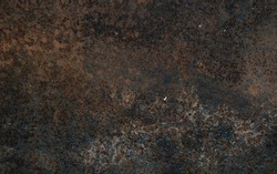 Rusty metal with a lot of black stains background.