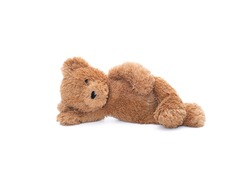 Teddy bear doll with one eye left lying on the floor isolated on white background.