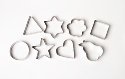 Metal cookie cutters on a white background