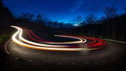 Long exposure showing the movement of traffic around horseshoe curve in the Appalachian mountains