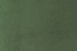 Blank wall color green dark verdant plaster paint stucco cement concrete rough surface texture background empty.