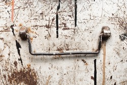 Old steel handle of metal industrial box close-up.