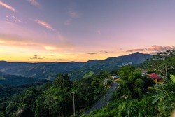 Beautiful sunset scenic with light shade into the mountain which locates in rural countryside at Doi Sakad, Pua, Nan, Thailand