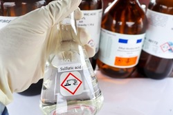 sulfuric acid in glass, chemical in the laboratory and industry