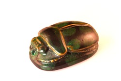 Egyptian scarab artifact isolated on a white background