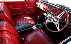 Nice red leather interior of a classic automobile
