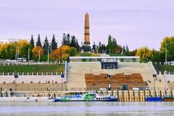 Beautiful view of the city from the Belaya River to the city of Ufa. Motor ships, boats on the water.Translation of the text - 