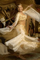 View of a young woman bellydancing