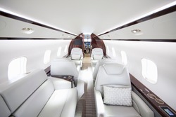 A wide shot showing interiors of a private jet.