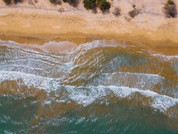 drone shot aerial view top angle bright sunny day beach coastal area backwaters turquoise blue water waves seascape white sand wallpaper background sea ocean tourism destination 