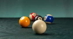 billiard balls on a green table 