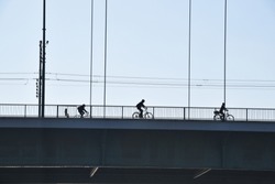 COLOGNE, MUELHEIM BRIDGE, GERMANY, 2015 - bicycles crossing rhine river