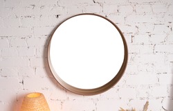 Round mirror with blank mock-up on a white brick wall. Home furnishings, bathroom interior. copy space for text. mockup