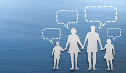 family of paper on a blue wooden background - speechbubbles above the head
