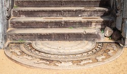 Sandakada Pahana, also known as Moonstone, is a unique feature of the architecture of ancient Sri Lanka. It is an elaborately carved semi-circular stone slab, placed at the bottom of the staircase.