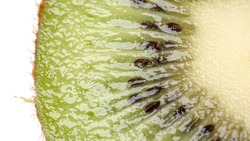 Close up of kiwi and kiwi slice isolated on white background. macro