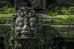 
Traditional Balinese statues or called Arca made of stone carvings in the form of gods, people or demons. Balinese sculpture in temple.