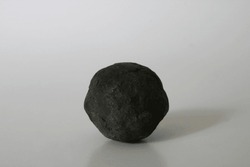 black round manganese nodule from deep ocean sea floor