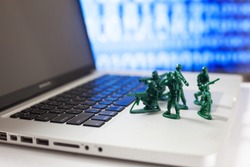 toy soldiers protect  computer from hacker attacks.