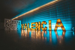 Lighted Valencia sign. City lights of Valencia, Spain.