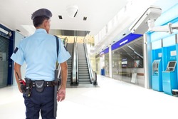 Security guard and CCTV in the elevator lobby, ATM banknote office building