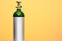 Medical Oxygen Tank Isolated on Yellow Background