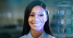 Futuristic and technological scanning of the face of a beautiful woman for facial recognition and scanning to ensure personal safety. 