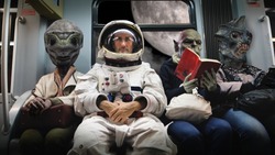 On a spaceship, an astronaut, sitting alongside extraterrestrial monsters, travel in total relaxation reading a book. Concept of space transport, surrealism, future, new worlds.