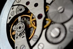 Clockwork. Macro shot of clock mechanism. Artistic blur