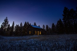 Old shack at night in winter