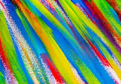 Background from different strokes of red, yellow, green and blue paint with brush close-up. Bright colorful backdrop of colored brush lines. Mixing color streaks of paint with cracked and scratched.