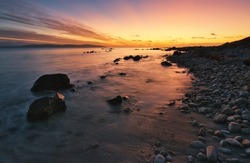 Beautiful seascape sunset scenery of rocky coast at wild atlantic way in Galway, Ireland 