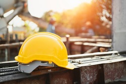 yellow helmet on steel in construction site