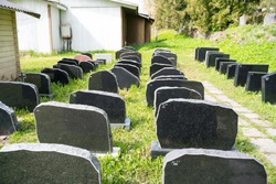 Polva/Estonia-05.10.2020: Graveyard gravestone store. Lots of black polished gravestones stored up behind cemetery. Prepared for lots of deaths. Corona virus deaths preperations. Grave stones lined up