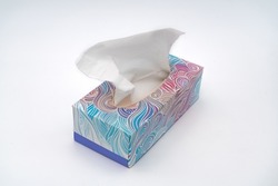 Full box of tissues. Nice colorful box with soft napkins for running nose. Best tool kit for allergy and flue. White background high resolution image 