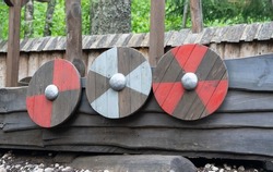Traditional viking ship. Shields on the side of the viking vessel. Playground item for kids. Fun place for kids to play in the middle of the viking village