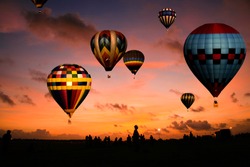 A balloon race at sunrise.