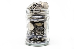 Coin in a jar on white background. Business financial and saving money concept.