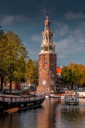 The Montelbaanstoren tower on Oudeschans canal in Amsterdam, Netherlands, built in 1516 for the purpose of defending the city.
