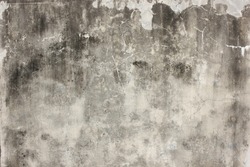 Abandoned aged cement outdoor wall of architecture building with dirty grey grunge rusty abstract texture.