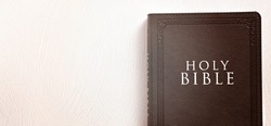 The Holy Bible on a Textured White Surface