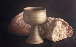 The Sacrament of Holy Communion  on a Dark Wooden Table