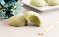 A Green Tea Matcha Mochi Ice Cream on a Kitchen Table