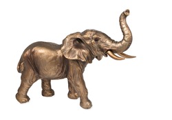 Bronze elephant figurine with a raised trunk isolated on white background